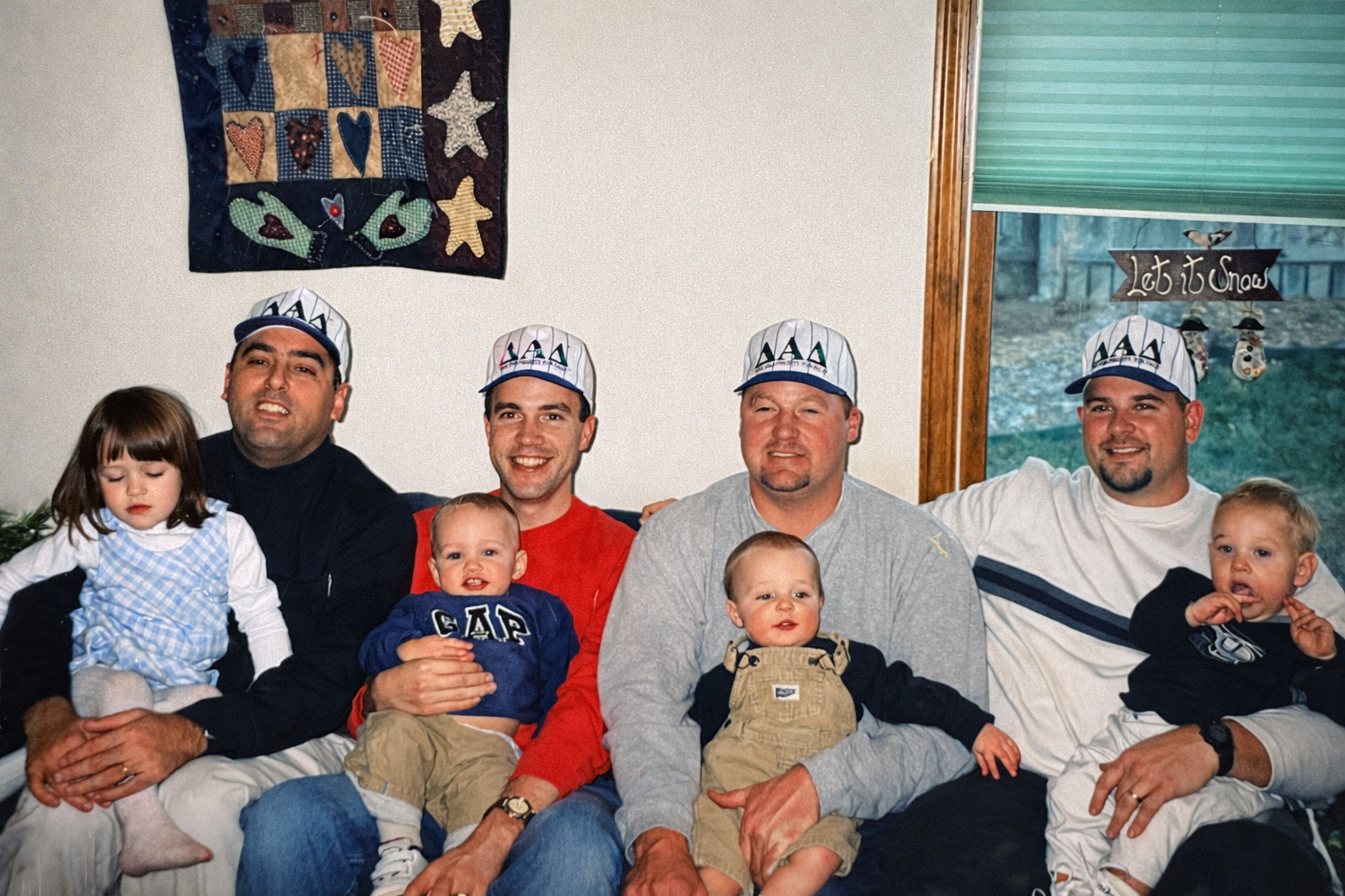 The original Delta Alpha Delta dads - Seth and the founding crew wearing their DAD caps with their kids
